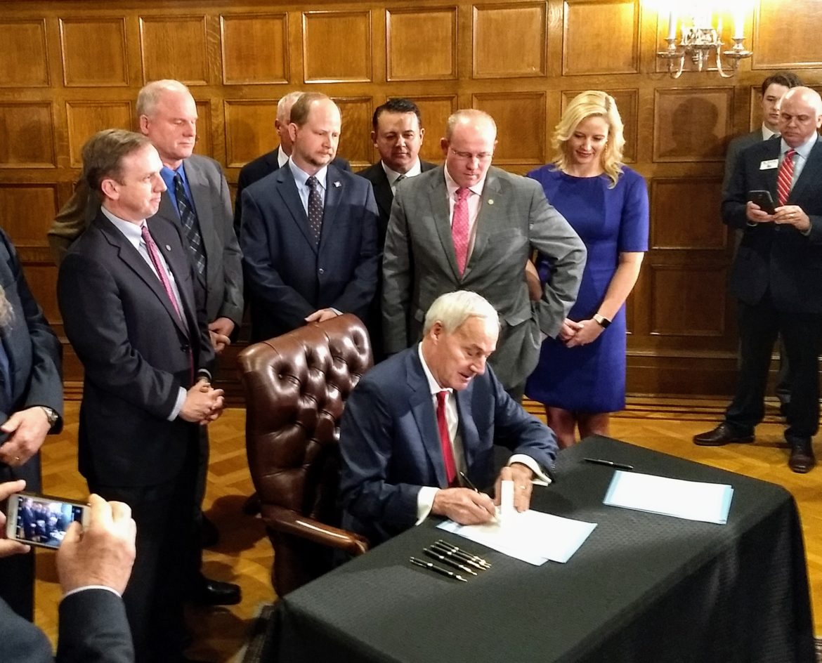 Governor signs $95 million highway funding bill, raising fuel taxes